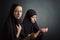 Two women pray