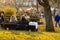 Two Women Relaxing on a Park Seat.