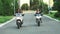 Two women are riding motorcycles at early evening without helmets