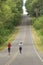 Two women running on rural road