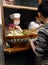 Two women selling local Sichuan street food on Jinli Street, Chengdu