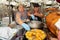 Two women serve roasted pig, Ecuador