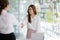 Two women shake hands, two businesswomen shake hands as they meet to discuss brainstorming and marketing plans to find more