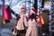 Two women share joy of shopping for Christmas outside the shopping centre