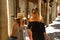 Two women with shopping bags in their hands looking at what they have bought very smiling