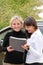 Two women signing a contract to buy a car