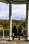 Two women sit dreamly looking on the pond in the city park