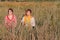 Two Women sitting in a Field