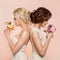 Two Women Smelling Flowers Bouquets, Beautiful Dreaming Bridesmaids Portrait, Back To Back