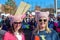 Two women in sunglasses and pink hats at Womens Day march in Tulsa Oklahoma USA 1-20-2018
