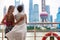 Two women taking the ferry in Shanghai city, China, crossing the Bund river looking at the view of famous pearl tv tower, landmark