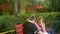 Two women talk about their problems, strolling in a warm summer evening in the park. Meeting girlfriends in the street