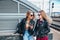 Two Women Talking in the City.Outdoor lifestyle portrait of two best friends hipster girls wearing stylish Leather