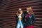 Two Women Talking in the City.Outdoor lifestyle portrait of two best friends hipster girls wearing stylish Leather
