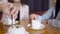 Two women are talking over cup of coffee in restaurant.