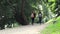 Two women tourists with backpacks are walking.