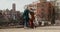 Two women tourists are sightseeing in a European city, from an observation deck