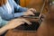 two women typing text on a laptop. european business women sending emails from a computer