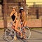 Two women with vintage bike. Outdoor fashion portrait