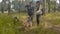 Two women volunteer walking with a dogs