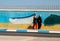 two women walking near the graffiti on the wall, Dakhla, Western Sahara