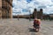 Two women wearing traditional clothes in the Plaza de Armas in the City of Cuzco, in Peru.