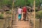 Two women on a wooden bridge in Myanmar