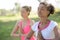 Two women in yoga prayer pose