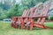 Two wooden adirondack chairs