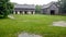 Two Wooden Barns with a Rain Storm