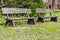 two wooden benches in a park