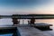 Two wooden chairs at Sunset on a pier on the shores of the calm Saimaa lakein Finland - 3