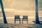 Two wooden chairs on a tropical beach during sunset. - Moon and