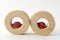 Two wooden circles with little red shinny lips