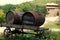 Two wooden fire barrels in a cart.