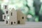 Two wooden houses model with wooden block number 2023 concept to show new house, new year property