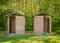 Two wooden huts used as toilets