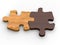 Two wooden jigsaw pieces put together