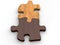 Two wooden puzzle pieces put together