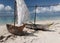 Two wooden sailing boats on tropical beach