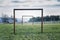 Two wooden soccer goals on green grass field, healthy active lifestyle and new year resolution concept