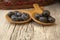 Two wooden spoons with fresh blueberries and wicker basket