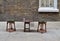 Two wooden stools and a small table