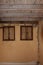 Two wooden windows inside very old house