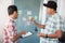 Two worker correcting a word on paper notes to make material discuss on meeting