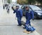 Two workers carry a heavy electric motor