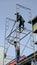 Two workers erect a scaffold