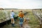 Two workers on the farmland outdoors