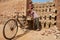 Two workers load bicycle with bricks in Dhaka, Bangladesh.