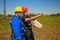 Two workers with masks control telecommunication antenna system